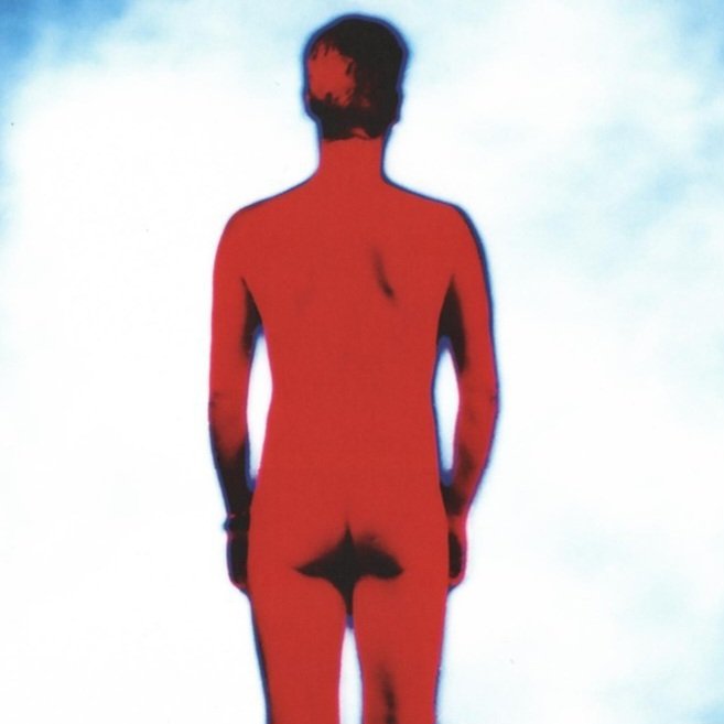 Foto van U2 album Achtung baby door Anton Corbijn. Adam Clayton naakt.